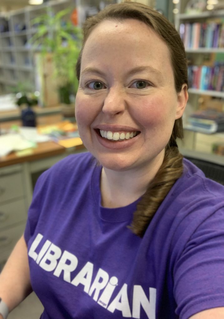 Picture of Kacy in a purple "librarian" t-shirt